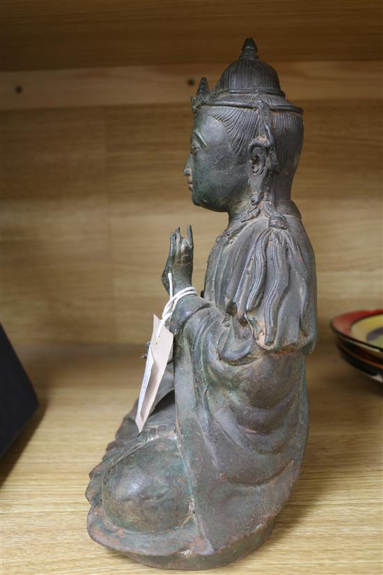 A Chinese bronze seated figure of a Buddha 29cm